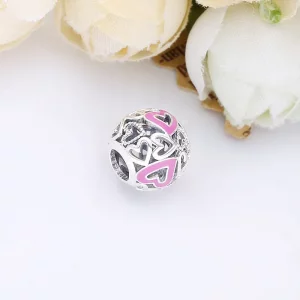 Ażurowy charms Pandora z różowym asymetrycznym sercem 798677C01