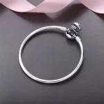 Srebrna bransoletka bangle Moments z zapięciem z płatkiem śniegu - 590740CZ - Bransoletki PANDORA